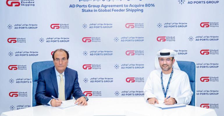 Amir Maghami, Chairman, GFS, (left), and Capt. Mohamed Al Shamisi, Managing Director and Group CEO, AD Ports Group, sign the agreement (AD Ports Group)[38].jpg
