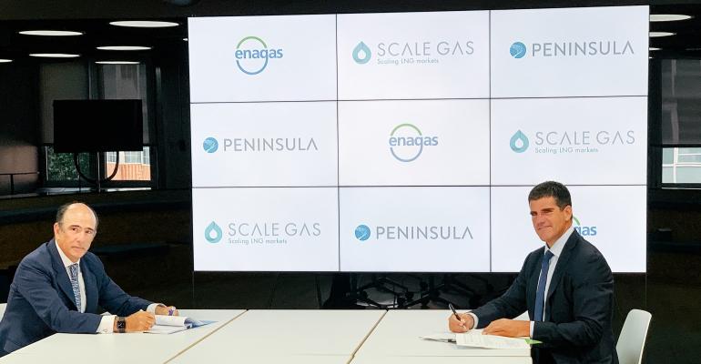Enagás Peninsula CEO signing.jpg