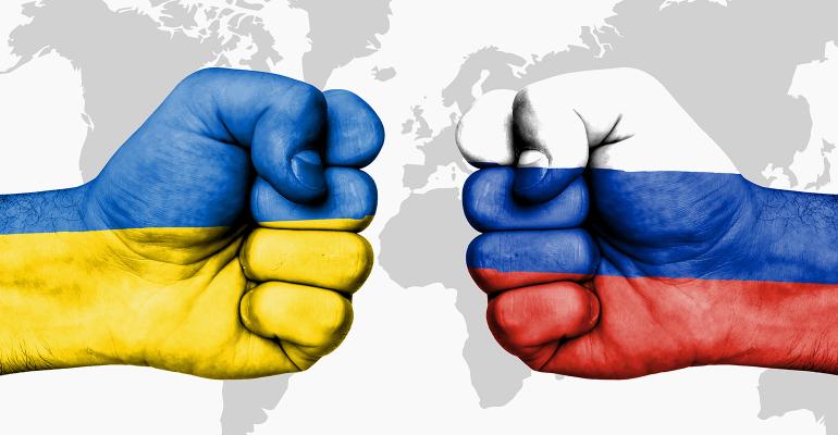 Conflict between Ukraine and Russia two fists with flag colors