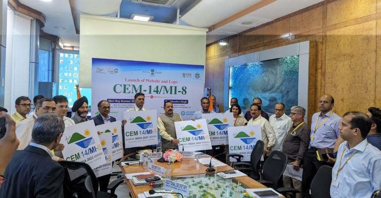 Representatives of CEM and the Indian government hold placards announcind the launch of the 14th Clean Energy Ministerial meeting in Goa