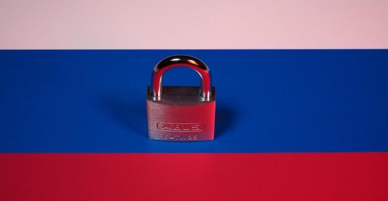 Padlock on Russian flag illustrating sanctions