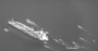 Iran's Islamic Revolutionary Guard Corps Navy fast-attack craft swarm Panama-flagged oil tanker Niovi as it transits the Strait of Hormuz