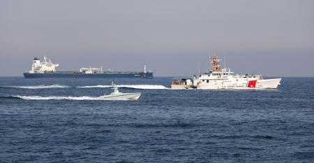 USCGC Charles Moulthrope (WPC 1141) and USCGC John Scheuerman (WPC 1146) transit the Strait of Hormuz with an L3Harris Arabian Fox MAST-13 unmanned surface vessel, April 19, 2023.
